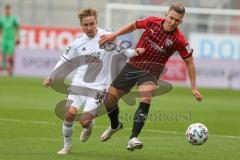 3. Fußball-Liga - Saison 2020/2021 - FC Ingolstadt 04 - SpVgg Unterhaching - Gordon Büch (#18,FCI) - Luca Marseiler (#30 Unterhaching) - Foto: Meyer Jürgen