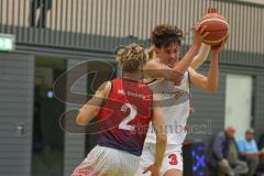 Basketball Bayernliga Herren - Saison 2026/27 - PSV Ingolstadt - TSV Milbertshofen - Petrovic Noel Dian weiss Ingolstadt - Schnug Josua rot Milbertshofen - Foto: Meyer Jürgen