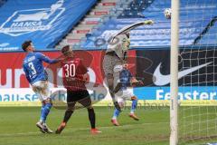 3. Liga - Hansa Rostock - FC Ingolstadt 04 - Torwart Markus Kolke (1 Rostock) rettet vor Stefan Kutschke (30, FCI) Julian Riedel (3 Rostock)