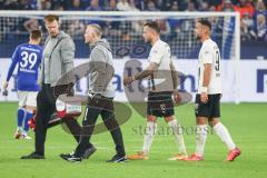 2.BL; FC Schalke 04 - FC Ingolstadt 04; Patrick Schmidt (32, FCI) bleibt verletzt am Boden uund wird von der medizinischen Abteilung vom Feld geholt Fatih Kaya (9, FCI)