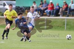 Kreisliga - Saison 2023/2024 - SV Menning - FC Mindelstetten - Alessandro Nikolaidis blau Menning - Michael Schneider weiss Mindelstetten - Foto: Meyer Jürgen