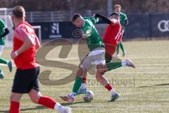 2024_2_17 - Saison 2023/24 - AUDI-Schanzer Amateur Cup - FC Gerolfing - TV 1861 Ingolstadt - Halbfinale 2 - Julien Bajer grün Gerolfing - Stefan Funk rot 1861 Ing. - Foto: Meyer Jürgen