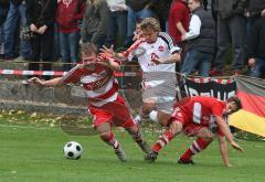 1.FC Nürnberg - FC Bayern II -Testspiel in Baar-Ebenahusen - mitte Daniel Gygax wird von links Stefan Rieß und rechts Timo Heinze unsaft gestoppt