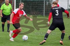A-Klasse - Saison 2022/2023 - TSV Unsernherrn - TV 1911 Vohburg - Florian Heckner rot Vohburg - Lukas Schwarzbauer schwarz Unsernherrn - Foto: Meyer Jürgen