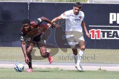 3. Liga; Testspiel; FC Ingolstadt 04 - FC Heidenheim; Zweikampf Kampf um den Ball Bryang Kayo (48, FCI) Dinkci Eren (FCH)