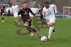 3. Liga - Saison 2023/24 - Testspiel - 1. FC Nürnberg - FC Ingolstadt 04 - Leon Guwara (Nr.6 - FCI) - Schleimer Lukas (#36 Nürnberg) - Foto: Meyer Jürgen