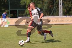 Testspiel - Bezirksliga - Saison 2025/26 - TSV Ober./Unterhaunstadt - Türkisch Ingolstadt  - Baha Asici rot Türkisch  - Florian Diegel weiss Ober./Unterh.stadt - Foto: Meyer Jürgen