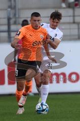 3.Liga - Saison 2023/2024 - SC Freiburg II - FC Ingolstadt 04 - Mladen Cvjetinovic (Nr.19 - FCI) - Lukas Ambros (Nr.36 - Freiburg II) - Foto: Meyer Jürgen