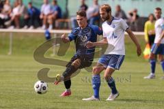 Kreisliga - Saison 2023/2024 - SV Menning - FC Mindelstetten - Simon Wolfsfellner blau Menning - Jonas Schoberer weiss Mindelstetten - Foto: Meyer Jürgen