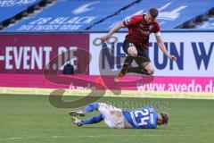 3. Liga - Hansa Rostock - FC Ingolstadt 04 - Stefan Kutschke (30, FCI) springt über Jan Löhmannsröben (24 Rostock)