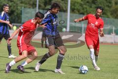 Testspiel - Bezirksliga - Saison 2025/26 - FC Fatih Ingolstadt - TSV Burgheim - Aaron Toski rot Fatih - Nick Vogel blau Burgheim - Atilla Demir rot rechts Fatih - Foto: Meyer Jürgen