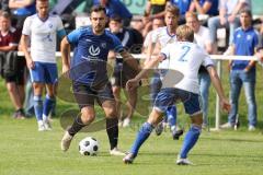 Kreisliga - Saison 2023/2024 - SV Menning - FC Mindelstetten - Johannes Boyer blau Menning - Jonas Schoberer weiss Mindelstetten - Foto: Meyer Jürgen