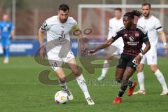 3. Liga - Saison 2023/24 - Testspiel - 1. FC Nürnberg - FC Ingolstadt 04 - Lukas Fröde (Nr.34 - FCI) - Hungbo Joseph (#23 Nürnberg) - Foto: Meyer Jürgen