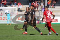 3.Liga - Saison 2022/2023 - SC Freiburg II - FC Ingolstadt 04 - Justin Butler (Nr.31 - FCI) - Julian Guttau (Nr.36 - SC Freiburg II) -  - Foto: Meyer Jürgen