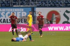 3. Liga - Hansa Rostock - FC Ingolstadt 04 - Spiel  ist aus, Unentschieden 1:1, Enttäuschung, hängende Köpfe,Michael Heinloth (17, FCI) Marc Stendera (10, FCI) Torwart Fabijan Buntic (24, FCI)