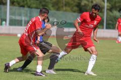 Testspiel - Bezirksliga - Saison 2025/26 - FC Fatih Ingolstadt - TSV Burgheim - Aaron Toski rot Fatih - Nick Vogel blau Burgheim - Atilla Demir rot rechts Fatih - Foto: Meyer Jürgen