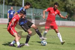 Testspiel - Bezirksliga - Saison 2025/26 - FC Fatih Ingolstadt - TSV Burgheim - Aaron Toski rot Fatih - Nick Vogel blau Burgheim - Atilla Demir rot rechts Fatih - Foto: Meyer Jürgen