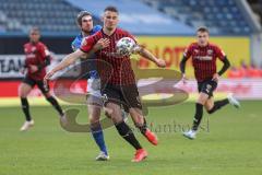 3. Liga - Hansa Rostock - FC Ingolstadt 04 - Stefan Kutschke (30, FCI) gegen Damian Roßbach (4 Rostock)