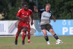 Testspiel - Bezirksliga - Saison 2025/26 - TSV Ober./Unterhaunstadt - Türkisch Ingolstadt  - Ousseynou Tamba rot Türkisch  - Florian Diegel weiss Ober./Unterh.stadt - Foto: Meyer Jürgen