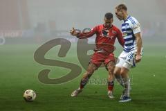 3. Liga; FC Ingolstadt 04 - MSV Duisburg; Zweikampf Kampf um den Ball Marcel Costly (22, FCI) Krüger Florian (26 MSV) Trikot zerrissen