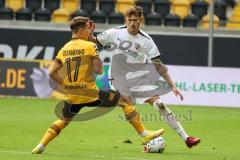 3.Liga - Saison 2022/2023 - Dynamo Dresden - FC Ingolstadt 04 -Calvin Brackelmann (Nr.17 - FCI) - Kyrylo Melichenko (Nr.17 - Dynamo Dresden) -  Foto: Meyer Jürgen