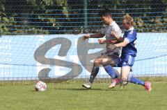 Kreisliga - Saison 2023/2024 - TSV Ober/Unterh.stadt- TSV Mümchsmünster - Nick Wagner blau Oberhstadt - Andre Bräuning grau M.Münster - Foto: Meyer Jürgen