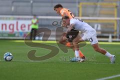 3.Liga - Saison 2023/2024 - SC Freiburg II - FC Ingolstadt 04 - Moritz Seiffert (Nr.23 - FCI) - Philip Fahrner (Nr.23 - Freiburg II) - Foto: Meyer Jürgen