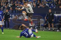 2.BL; FC Schalke 04 - FC Ingolstadt 04; Dennis Eckert Ayensa (7, FCI) springt über Itakura Ko (3 S04)