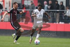 3. Liga - Saison 2023/24 - Testspiel - 1. FC Nürnberg - FC Ingolstadt 04 - Hübner Florian (#19 Nürnberg) - Bryang Kayo (Nr.48 - FCI) - Foto: Meyer Jürgen