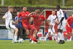 Kreisliga - Saison 2025/26- SV Zuchering - FC Mindelstetten - Philip Delanowski rot Zuchering - Qusseynou Tamba weiß Mindelstetten  - Michael Schneider weiß Mindelstetten  links - Foto: Meyer Jürgen