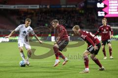 2.BL; 1. FC Nürnberg - FC Ingolstadt 04; Zweikampf Kampf um den Ball Florian Pick (26 FCI) Tempelmann Lino (6 , 1.FCN) Handwerker Tim (29 , 1.FCN) Möller Daehli Mats (24 , 1.FCN)