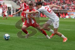 3. Liga - Saison 2023/24 - Rot-Weiss Essen - FC Ingolstadt 04 -  - Arian Llugiqi (Nr.25 - FCI) - Nils Kaiser (#18 Essen) - Foto: Meyer Jürgen