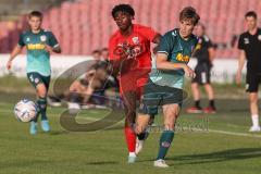 Bayernliga Nord - Saison 2023/2024 - FC Ingolstadt 04 - SSV Jahn Regensburg - Michael Udebuluzor (Nr.24 - FCI U21) - Paul Gebhard grün Regensburg - Foto: Meyer Jürgen