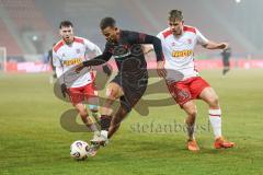 3. Liga; SSV Jahn Regensburg - FC Ingolstadt 04; Zweikampf Kampf um den Ball Marcel Costly (22, FCI) Seidel Nick (33 SSV) Schönfelder Oscar (7 SSV)