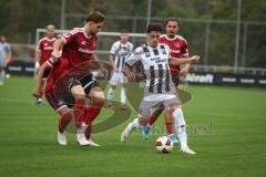 Saison 2026/27 - Freundschaftsspiel - 1. FC Nürnberg - FC Ingolstadt 04 - Dennis Kaygin (Nr.10 - FCI) - Styopa Mkrtchyan (Nr.5 - FCN)links - Foto: Meyer Jürgen