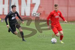 Bayernliga Süd - Saison 2021/2022 - FC Ingolstadt 04 II - TürkAugsburg - Brunner Jonas (#3 FCI) rot - Berkan Aydin
 schwarz Augsburg - Foto: Meyer Jürgen