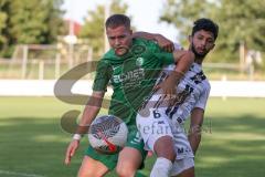 Freundschaftsspiel - Saison 2023/2024 - SV Manching - AL Jazira - Fabian Neumayer (Nr.9 - SV Manching) - Mohammed Omar Alattas weiss AL Jazira - Foto: Meyer Jürgen