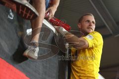 Toto-Pokal - Saison 2023/2024 - FC Ingolstadt 04 - Jahn Regensburg - Elfmeterschießen gewonnen - jubel - Torwart Marius  Funk (Nr.1 - FCI) hält den Elfmeter - auf dem weg zu den Fans - Megaphon - Foto: Meyer Jürgen