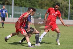 Testspiel - Bezirksliga - Saison 2025/26 - FC Fatih Ingolstadt - TSV Burgheim - Aaron Toski rot Fatih - Nick Vogel blau Burgheim - Atilla Demir rot rechts Fatih - Foto: Meyer Jürgen