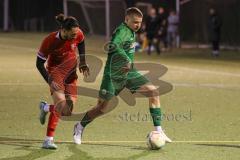 2024_2_8 - Bezirksliga - Saison 2023/24 - Freundschaftsspiel - FC Fatih Ingolstadt - SV Manching -  - Sebastian Graßl grün Manching - Atilla Demir rot Fatih - Foto: Meyer Jürgen