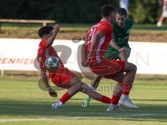 Landesliga - Saison 2026/27 - SV Manching - FC Memmingen II - Tezcan Mustafa rot Memmingen - Daniel Schweiger (Nr.11 - SV Manching) - Schafft Pius rot Memmingen rechts - Foto: Meyer Jürgen