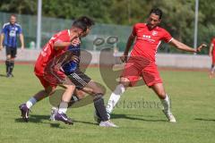 Testspiel - Bezirksliga - Saison 2025/26 - FC Fatih Ingolstadt - TSV Burgheim - Aaron Toski rot Fatih - Nick Vogel blau Burgheim - Atilla Demir rot rechts Fatih - Foto: Meyer Jürgen