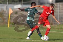 Bayernliga Nord - Saison 2023/2024 - FC Ingolstadt 04 - SSV Jahn Regensburg - Benedikt Schwarzensteiner (Nr.4 - FCI U21) - Kelvin Onuigwe grün Regensburg - Foto: Meyer Jürgen