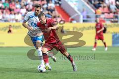 3. Liga; FC Ingolstadt 04 - FC Hansa Rostock; Zweikampf Kampf um den Ball Gustav Christensen (24, FCI) Stock Paul (10 HR)