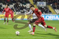 3. Liga; SSV Ulm - FC Ingolstadt 04; Linus Rosenlöcher (19, FCI) Zweikampf Kampf um den Ball Bazzoli Luca (18 Ulm)