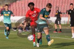 Bayernliga Nord - Saison 2023/2024 - FC Ingolstadt 04 - SSV Jahn Regensburg - Michael Udebuluzor (Nr.24 - FCI U21) - Paul Gebhard grün Regensburg - Foto: Meyer Jürgen