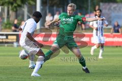 Freundschaftsspiel - Saison 2023/2024 - SV Manching - AL Jazira - Reiner Meisinger (Nr.8 - SV Manching) -  Mamadou Coulibari weiss AL Jazira - Foto: Meyer Jürgen