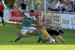 Landesliga - FC Gerolfing -SV Kirchanschöring -  Haunschild Philipp #21 grün Gerolfing - Straßer Alois #14 schwarz Kirchanschöring -  Foto: Jürgen Meyer