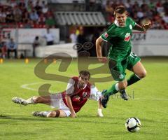 FC Ingolstadt 04 - Wolfsburg - links Markus Karl am Boden. Zvezdan Misimovic hat ihm den Ball abgenommen