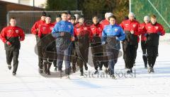 3.Liga - FC Ingolstadt 04 - Trainingsauftakt nach Winterpause - Warmlaufen mit dem neuen Co-Trainer Henning Bürger rechts, Stefan Schaidnagel links